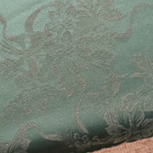 Bright green tablecloth 58x83" satin background w. Green floral design.